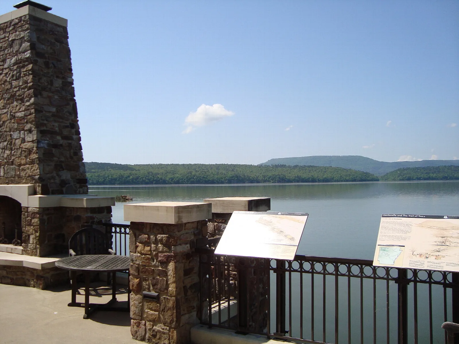 Stone overlook with railings above the lake
