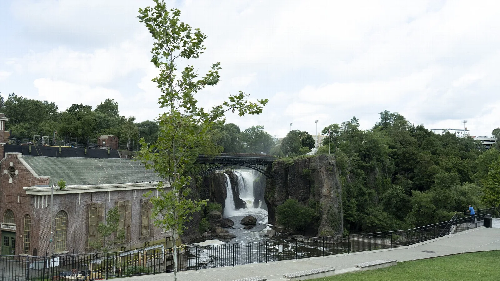 Overlook lawn with the falls and brick power house in the distance