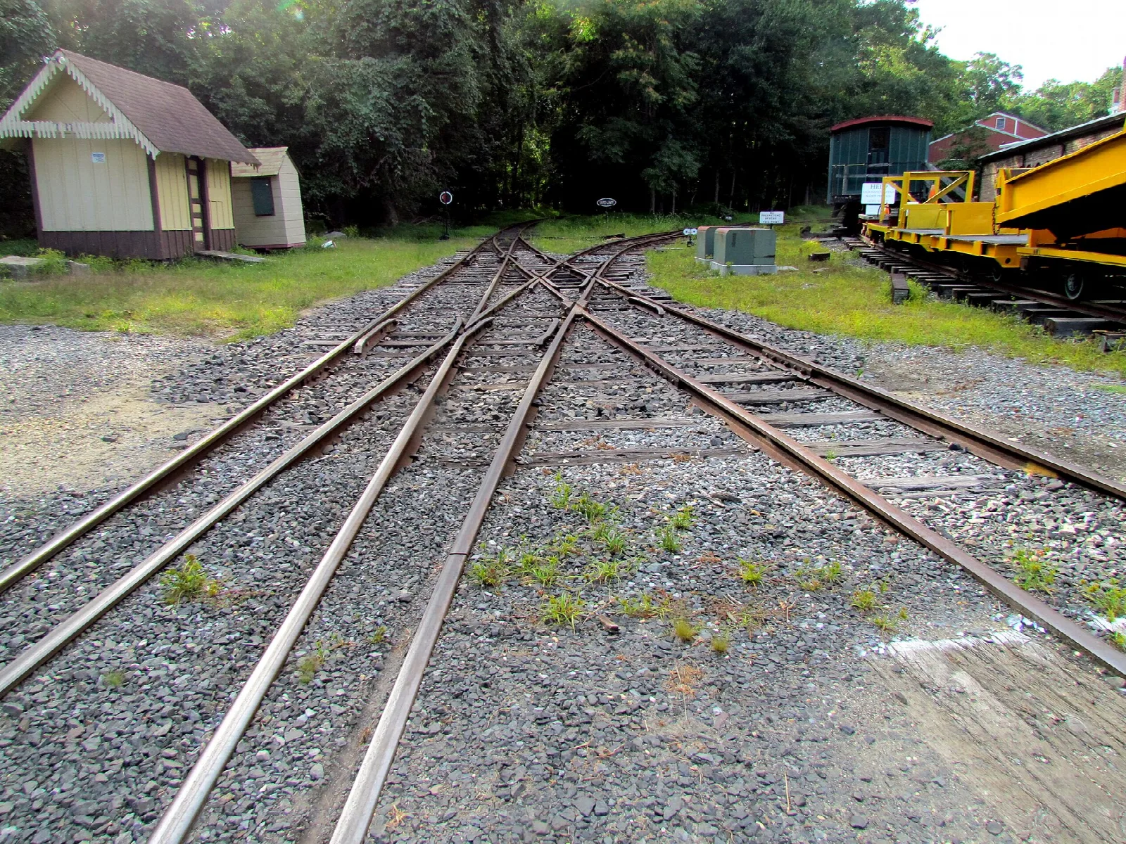 Railroad tracks with small station buildings behind