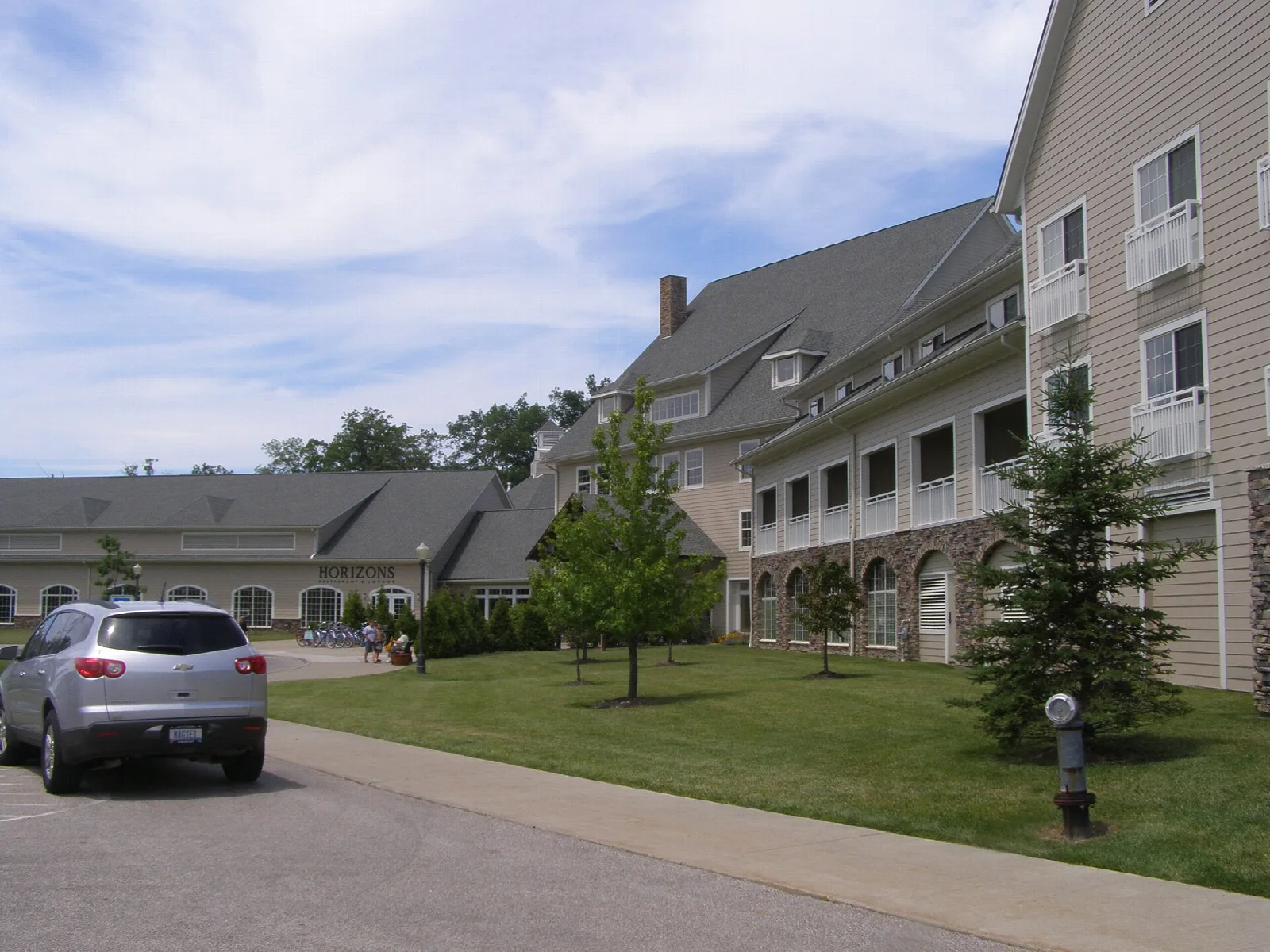 Large lodge building with a lawn and walkway