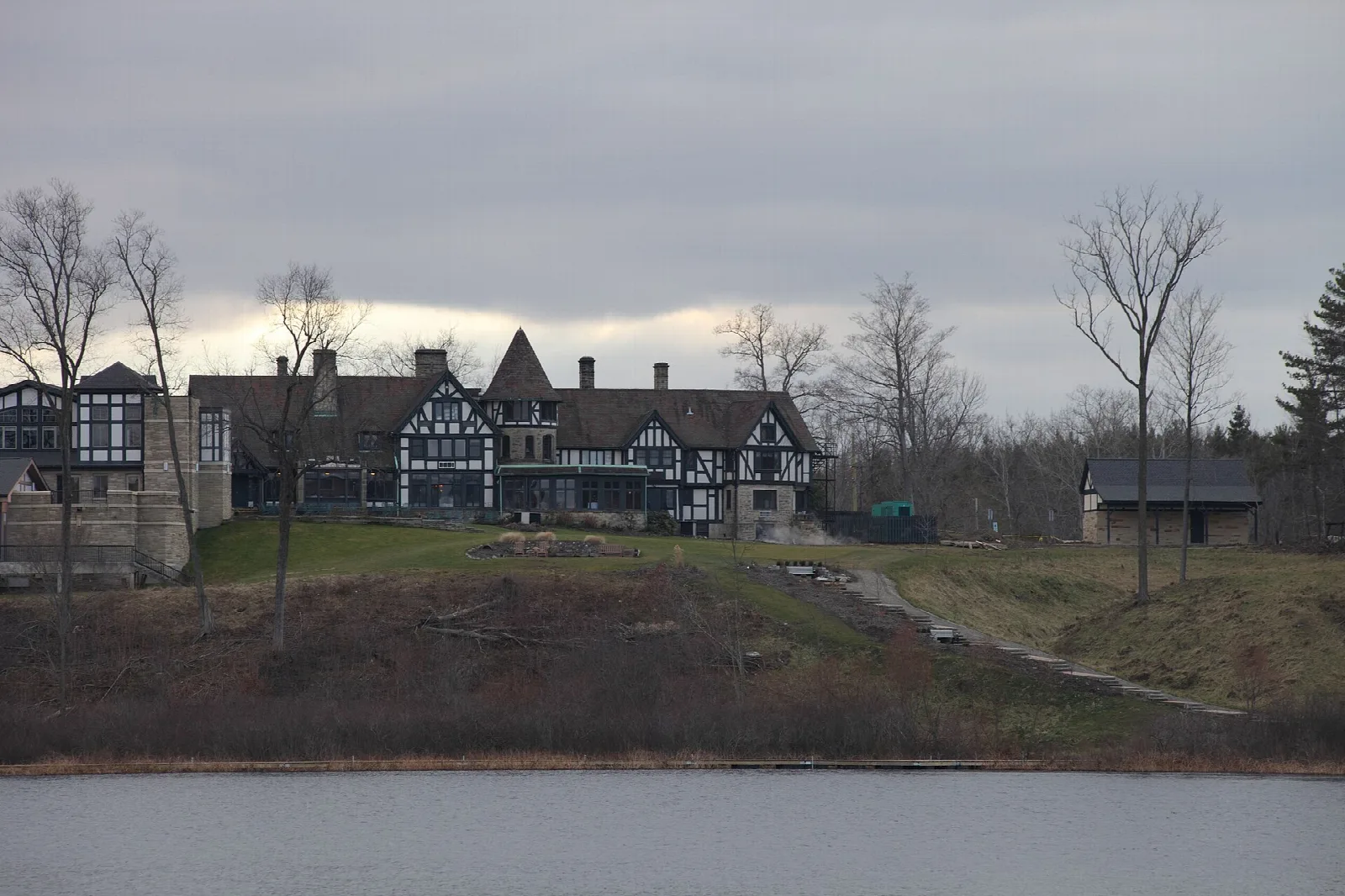 Tudor-style manor on a hill above the lake