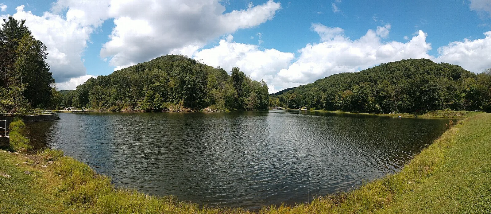 Pine Lake ringed by wooded hills in summer