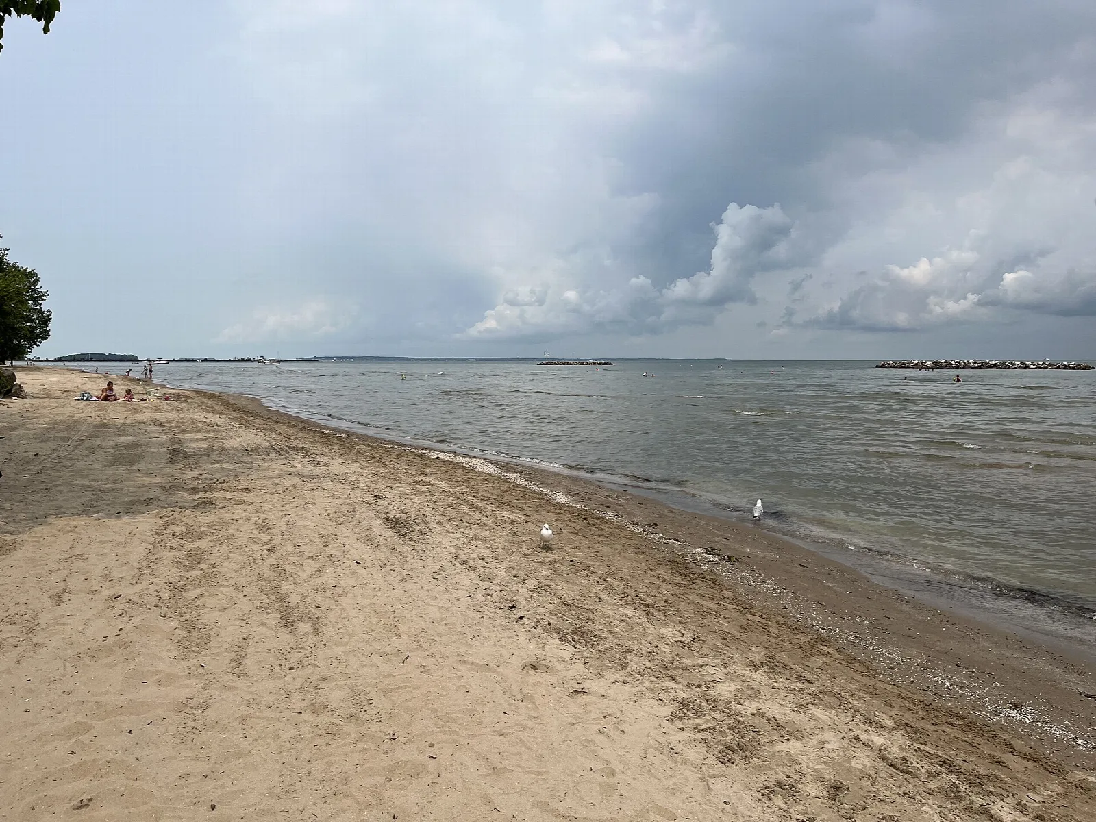 Sandy beach along Lake Erie under cloudy skies