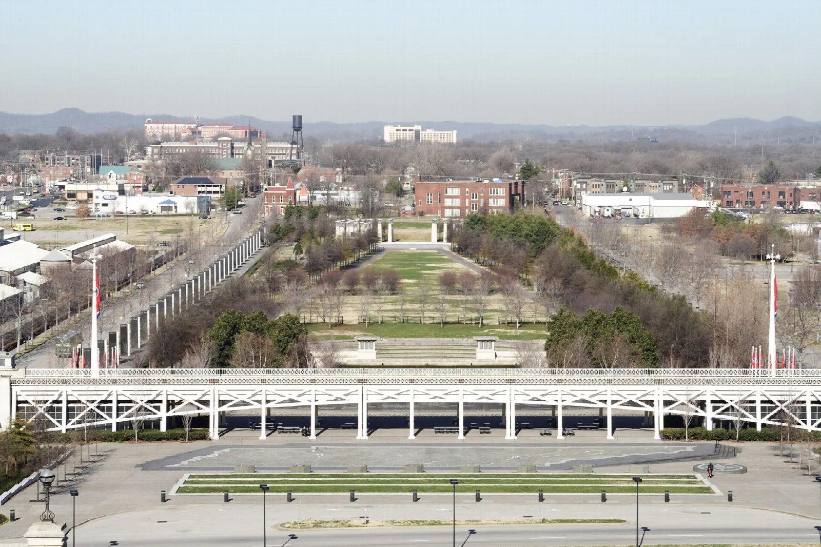 Long park mall with a lawn and trees seen from the state capitol
