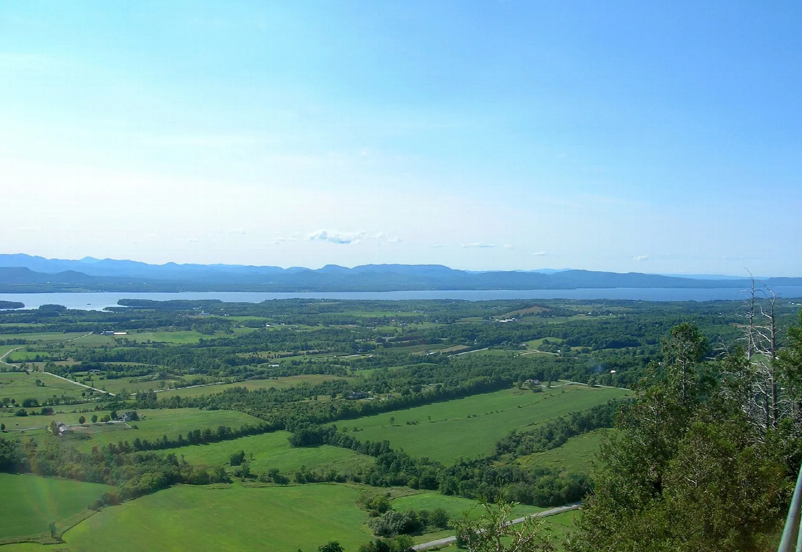 Northwest view over farmland and wooded hills toward Lake Champlain