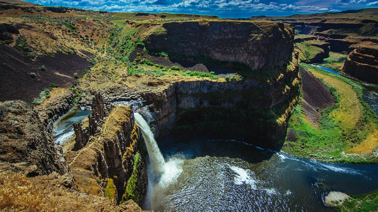 Aerial-style view of the canyon, falls and green river bends