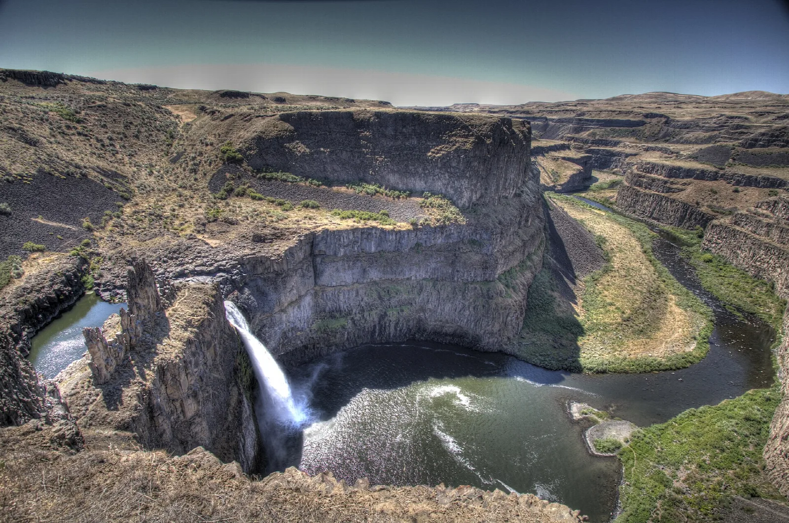 Waterfall in a deep horseshoe basalt canyon