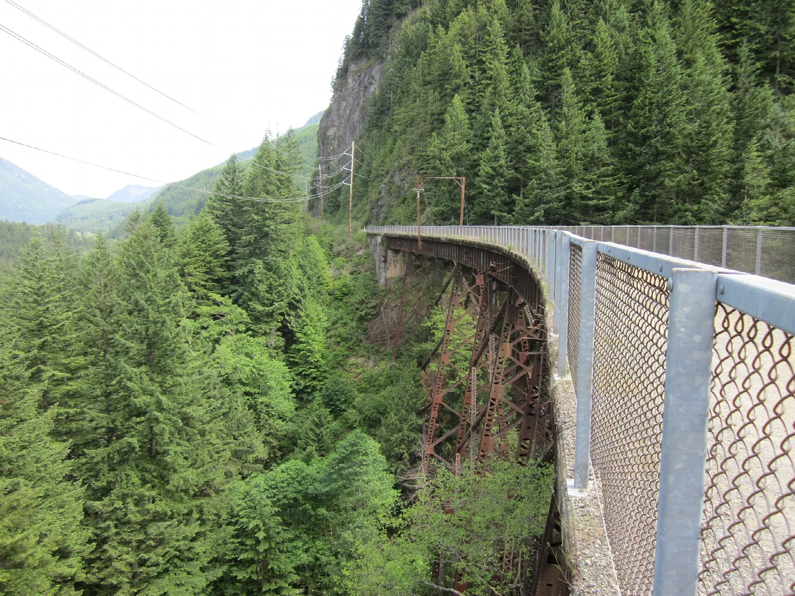 Old railroad trestle crossing a forested valley