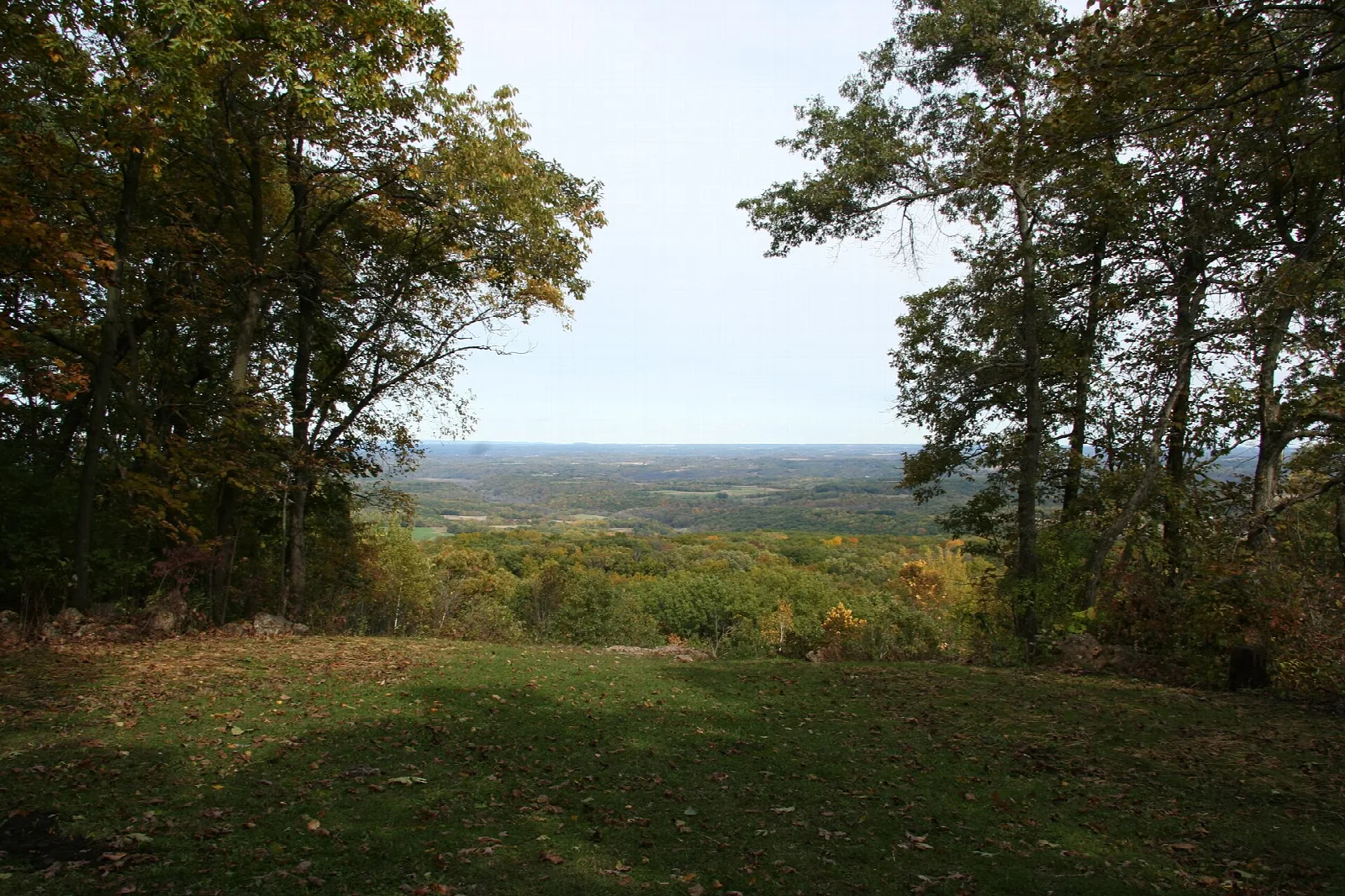 Autumn trees framing a distant valley view