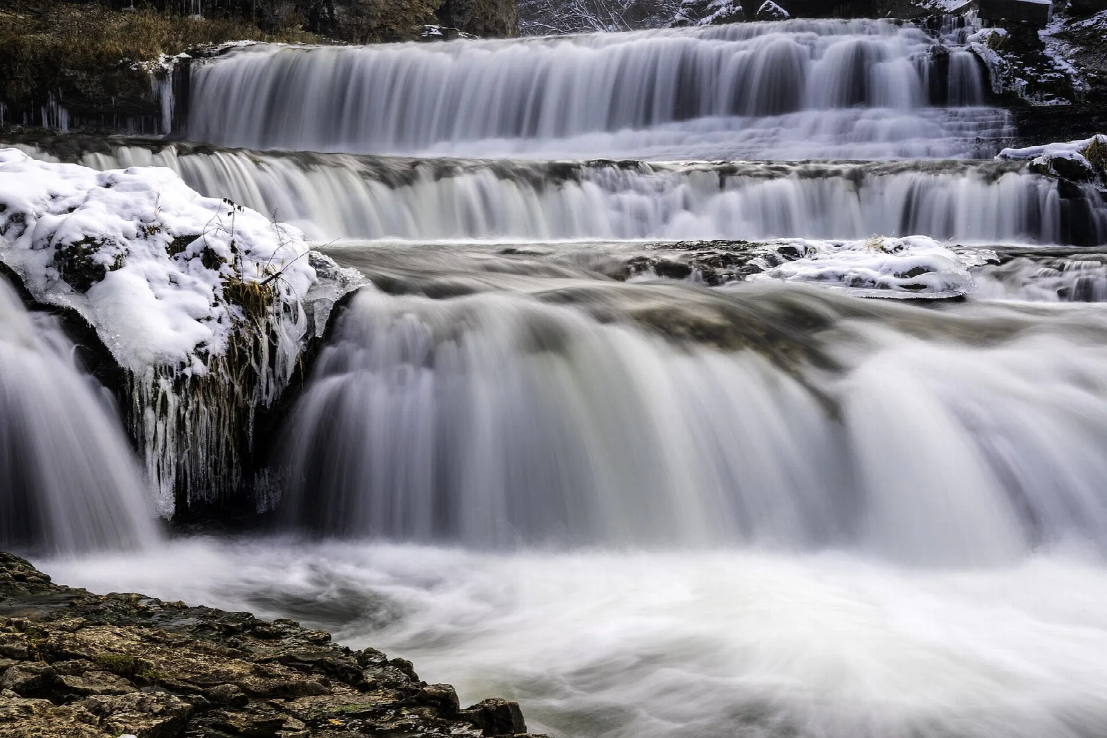 Layers of white water spilling over rock ledges