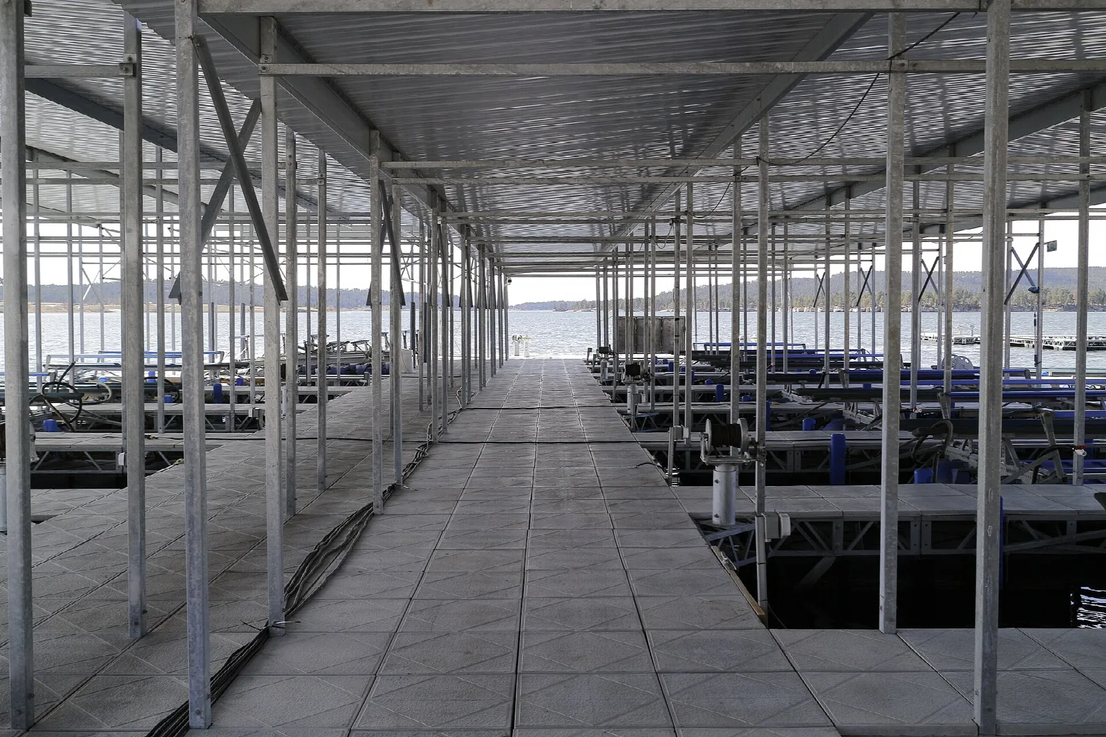 Covered boat dock with walkway over the water