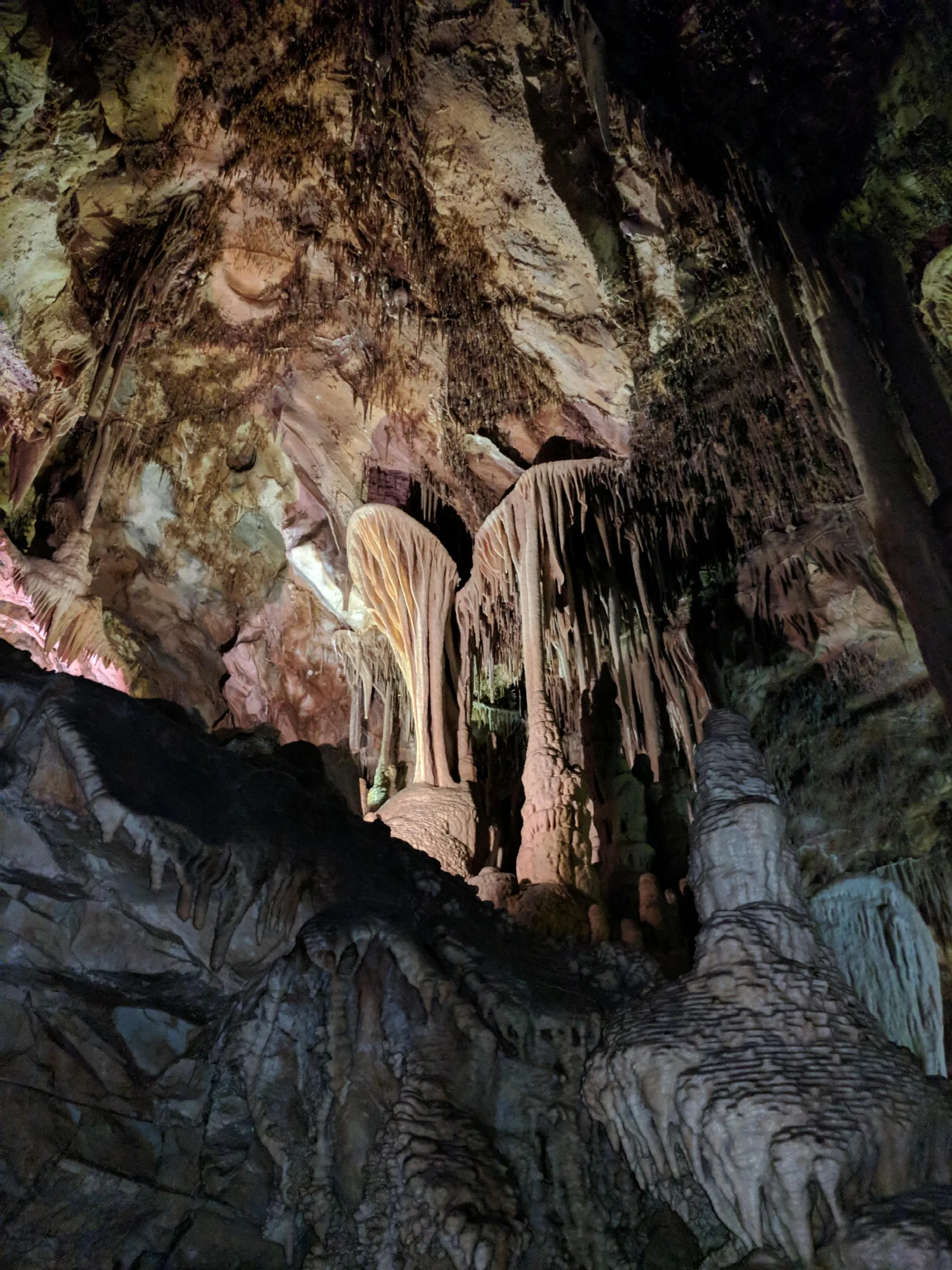 Brown and tan cave formation in the shape of a parachute