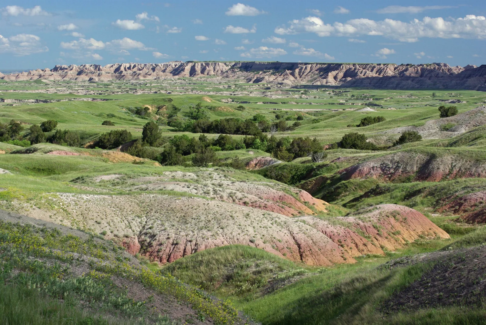 The yellow mounds are peaking out of the formations in this photo.