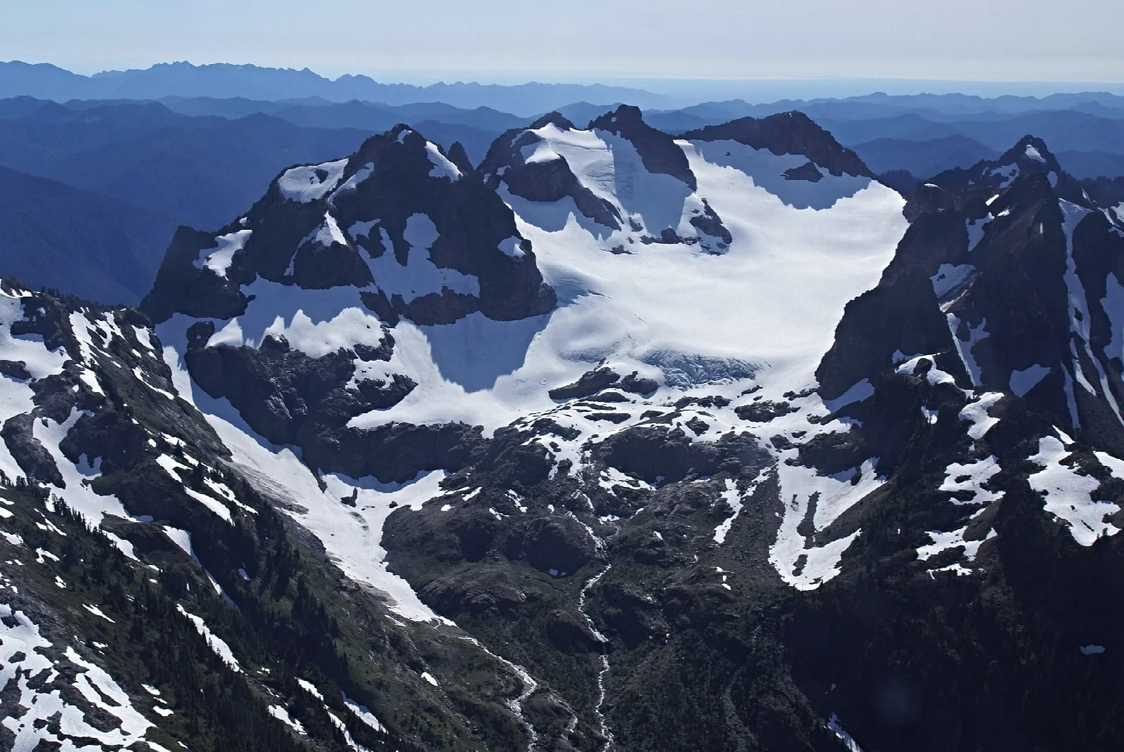 Jagged snowy peaks and glaciers in the Olympic Mountains