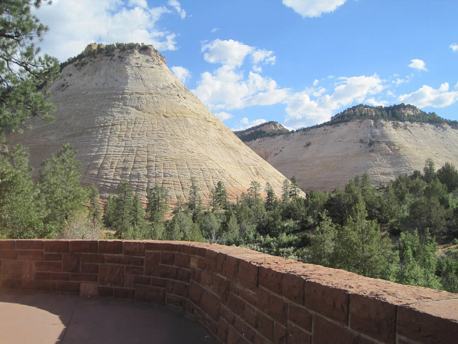 A pale sandstone dome etched with a crosshatched pattern