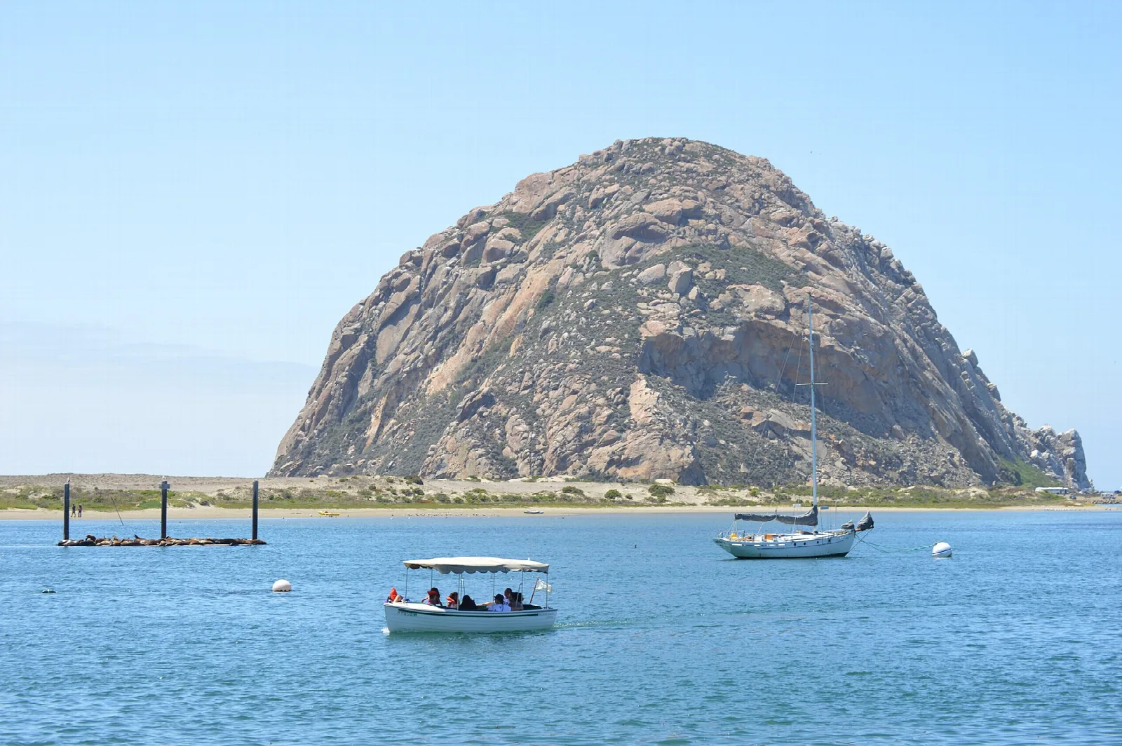 Morro Rock with small boats on the bay