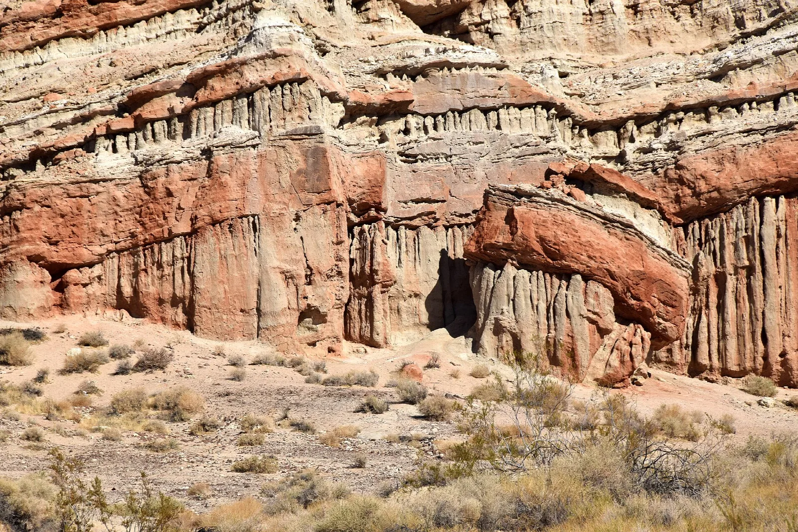 Close view of red and white eroded cliff face