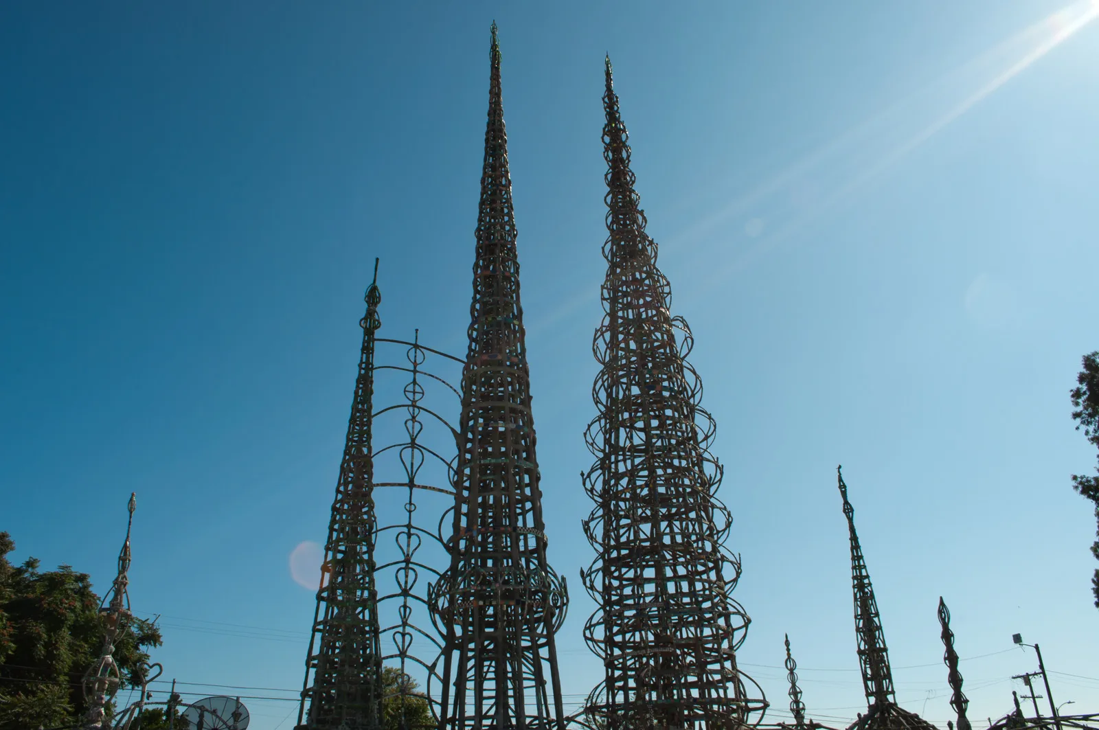 Row of spired lattice towers against a clear sky