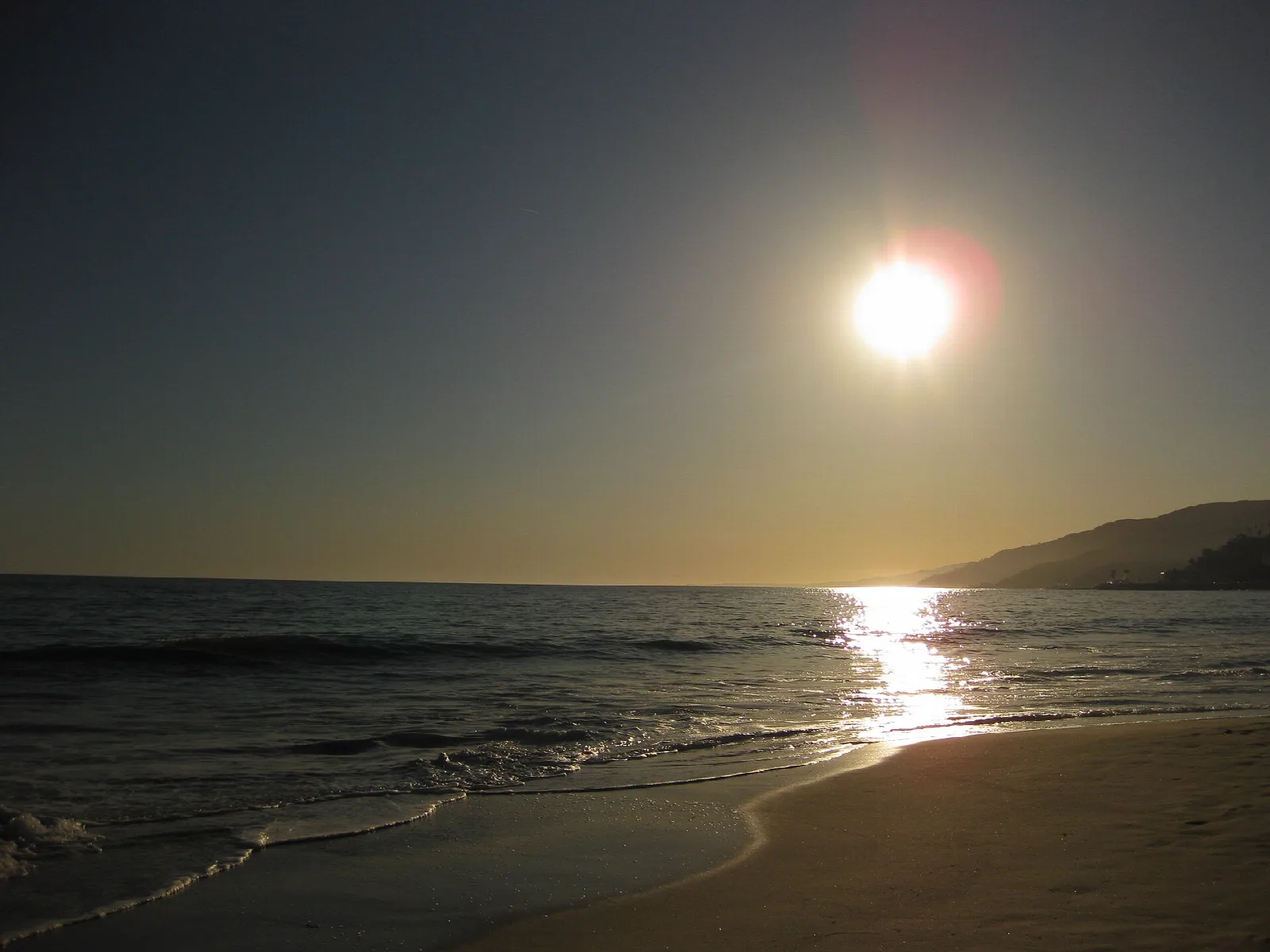 Low sun over the Pacific and a quiet shoreline