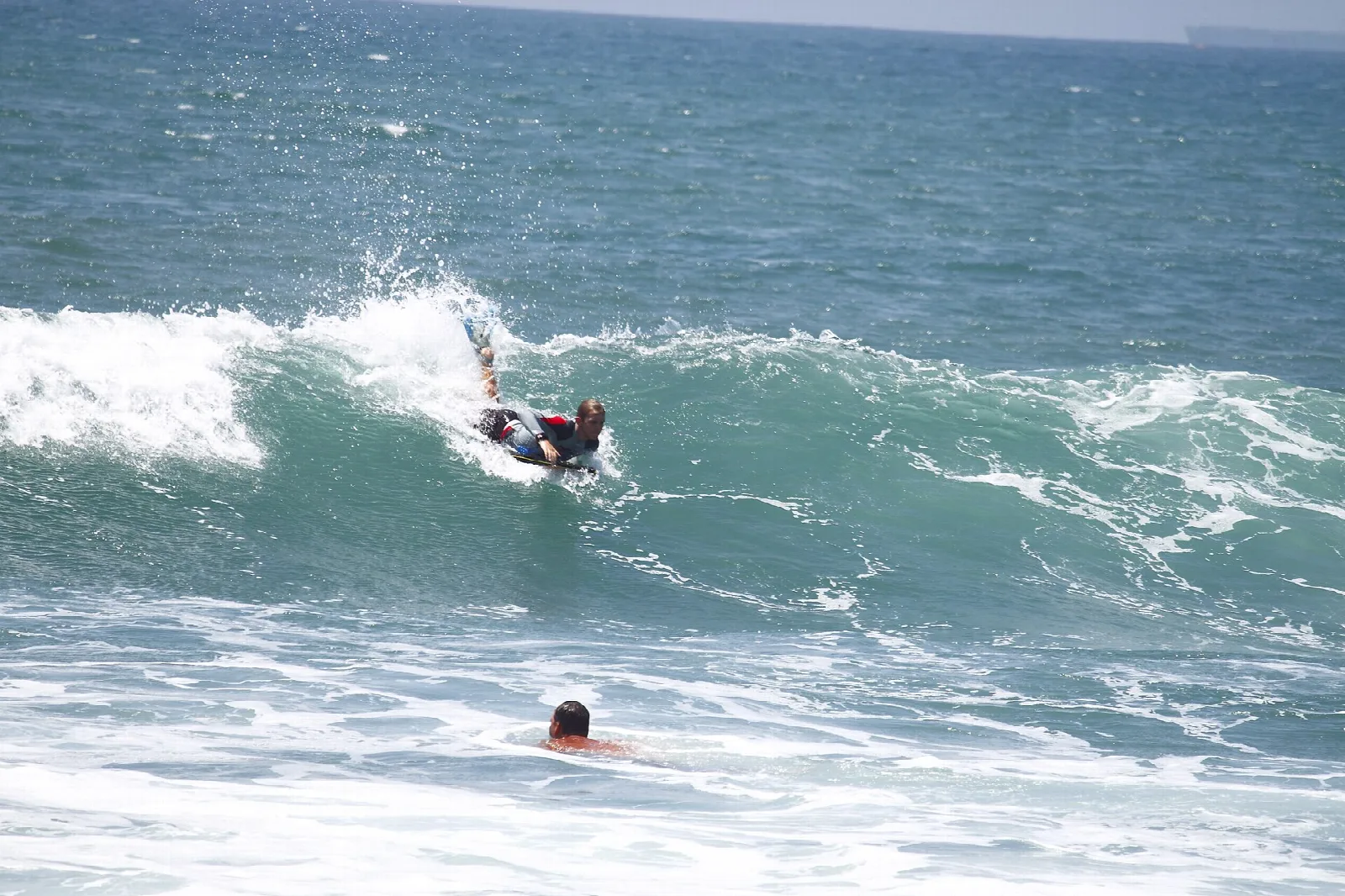 Bodyboarder riding a breaking wave