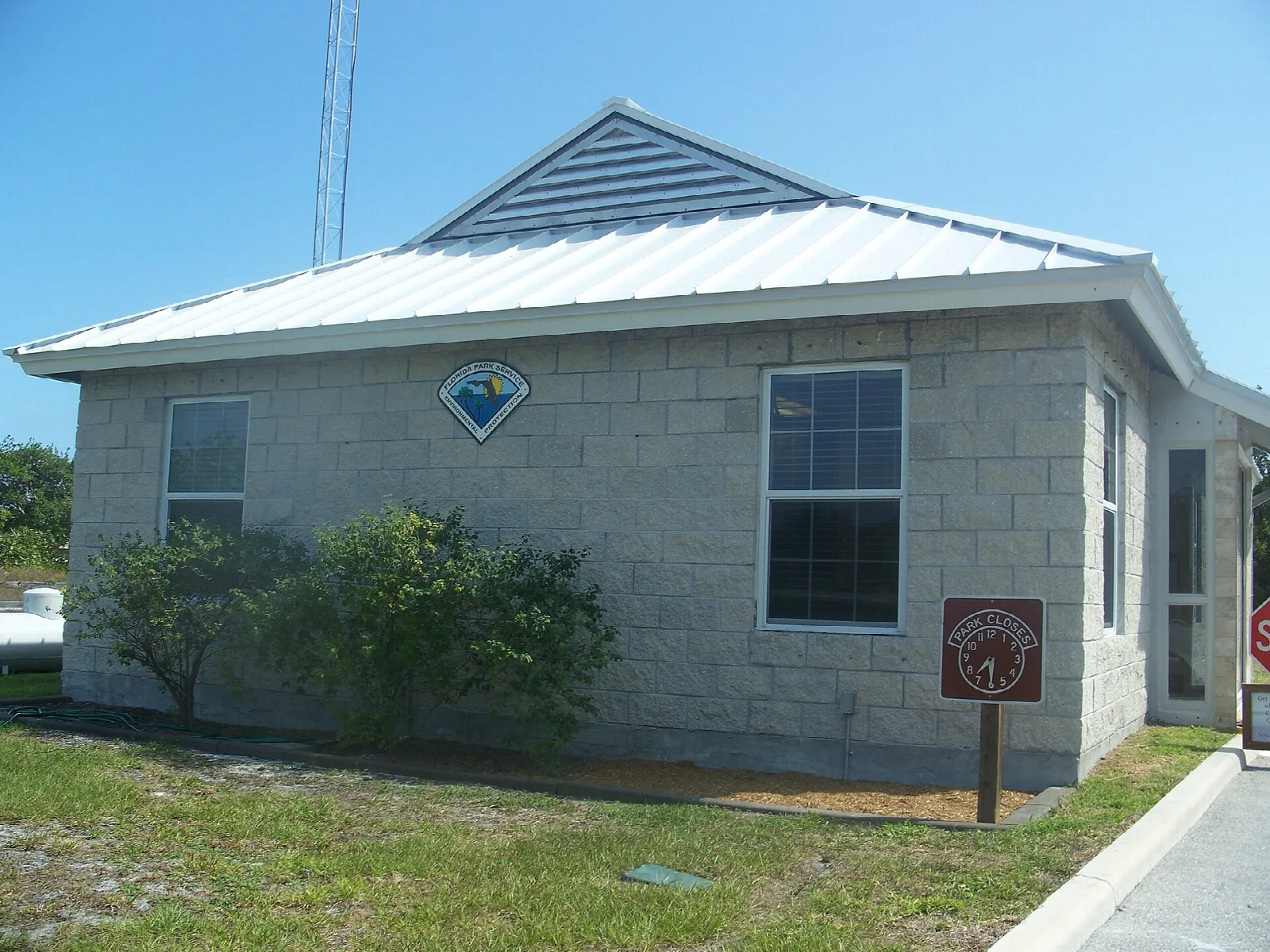 Small stone-block ranger station with a metal roof