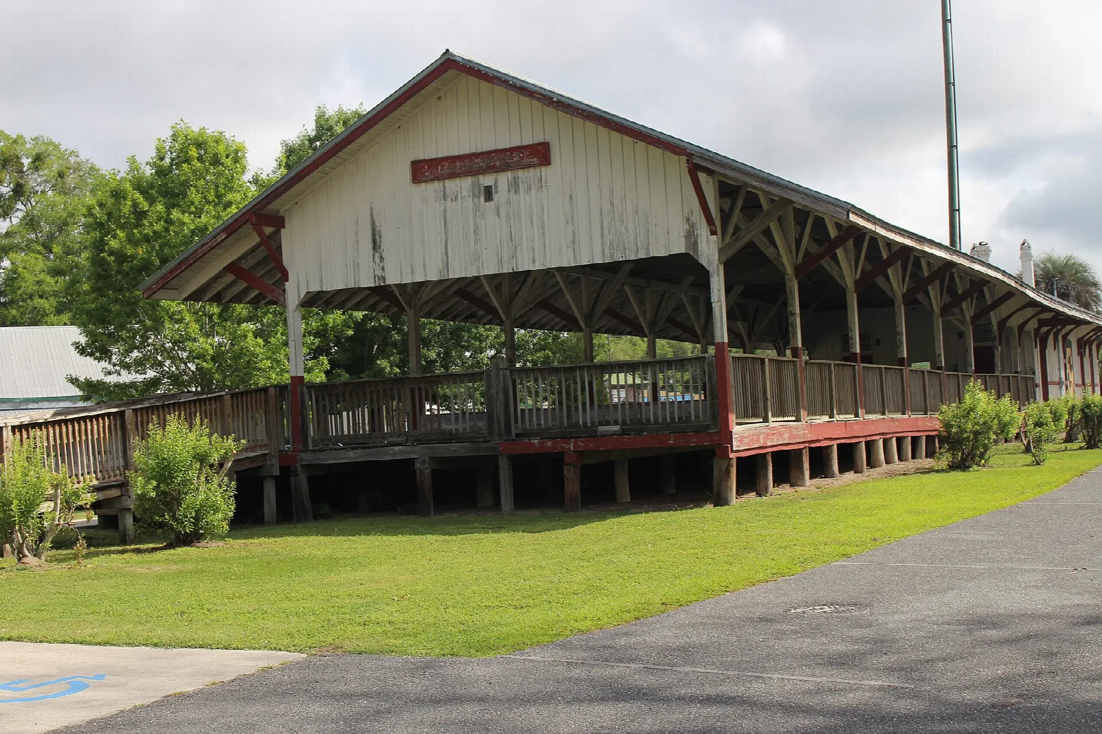 Long covered wooden platform of a historic railroad depot