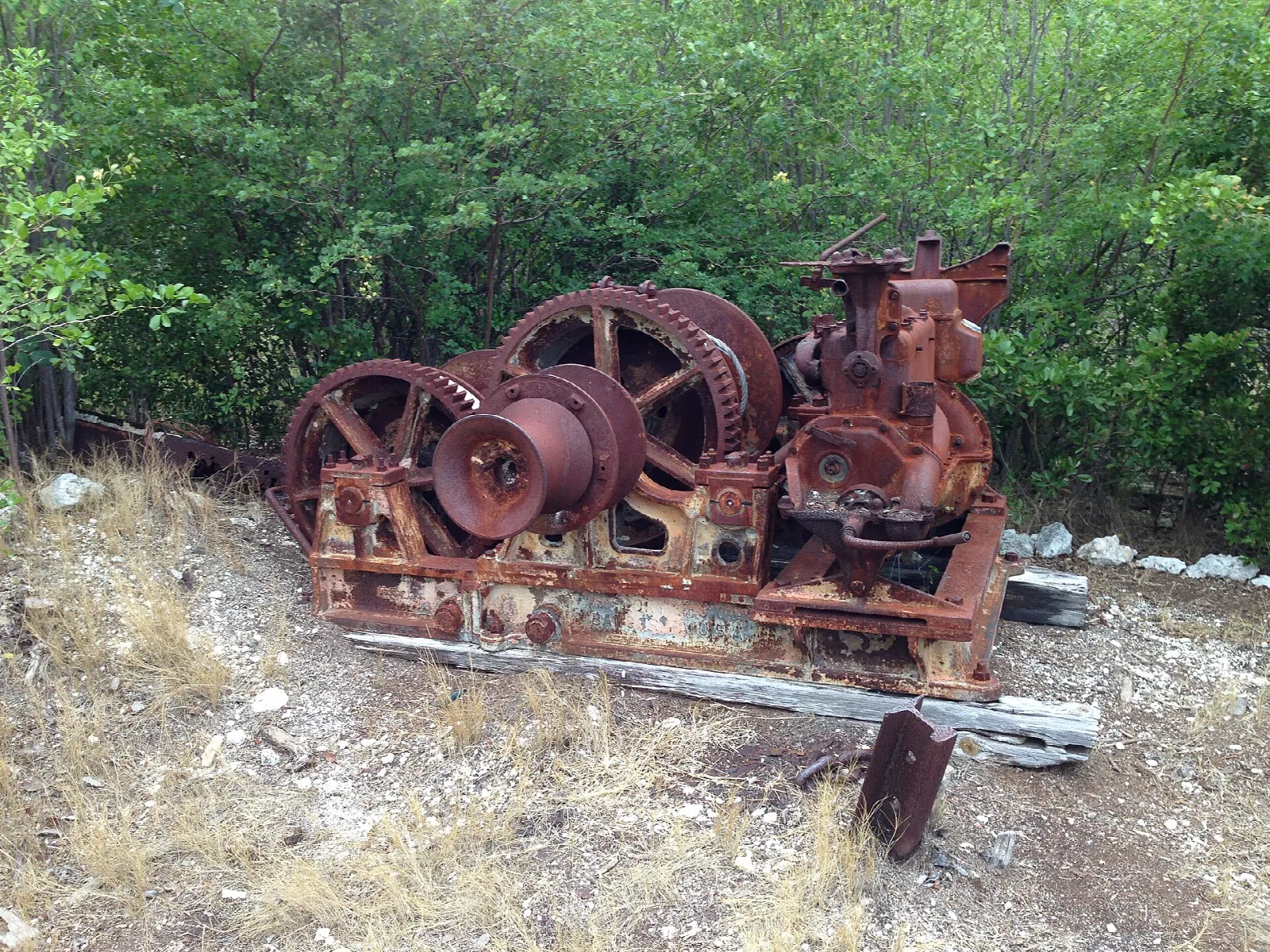 Rusty old quarry winch machinery in a clearing