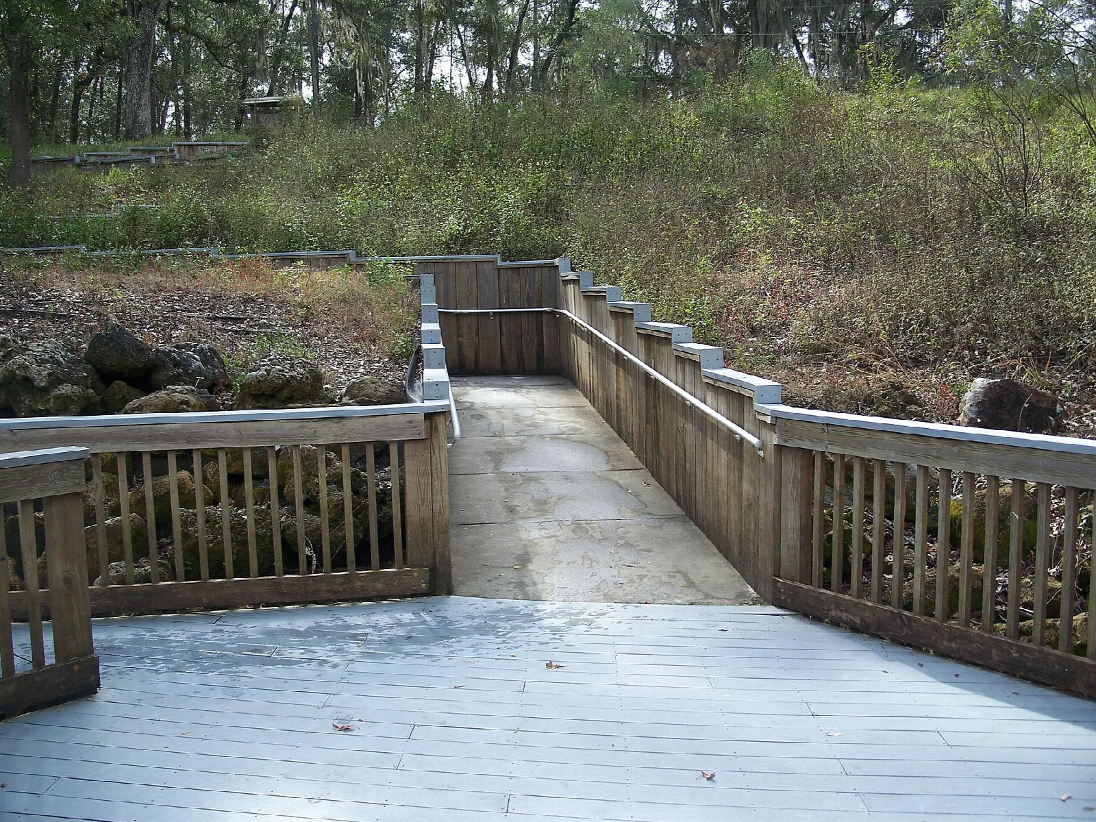 Wooden observation platform with railings at the spring