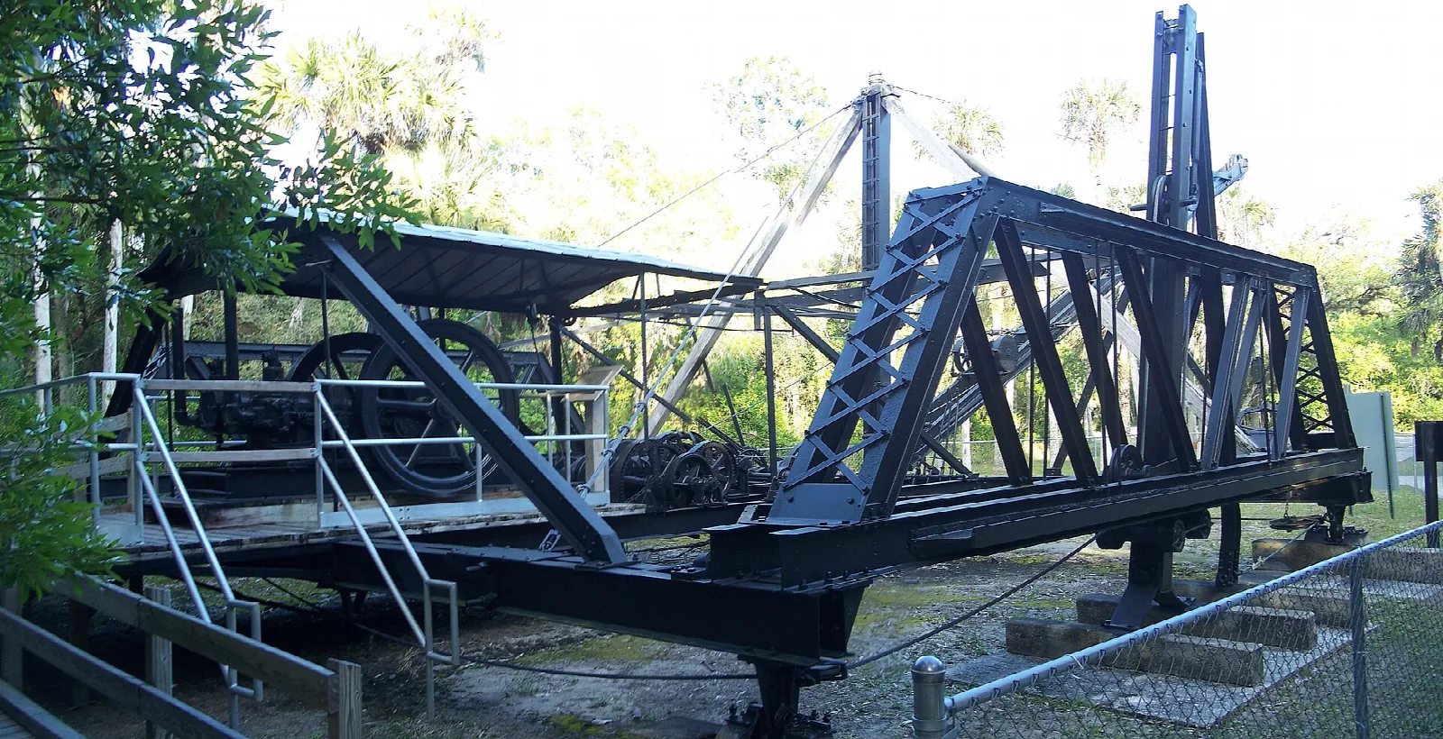 Steel dredge frame and cables with a wooden walkway