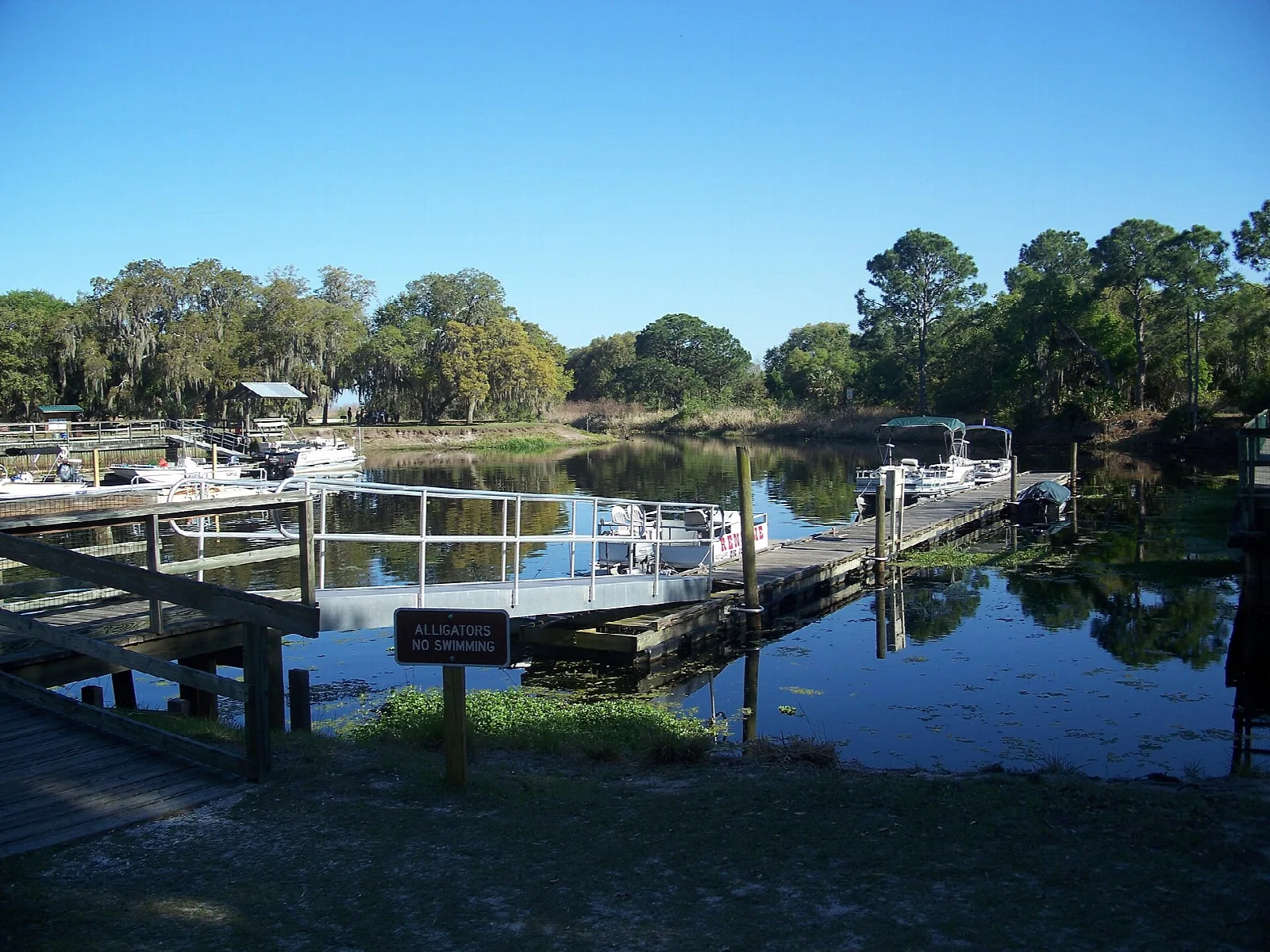 Boat dock and pier on a calm still waterway