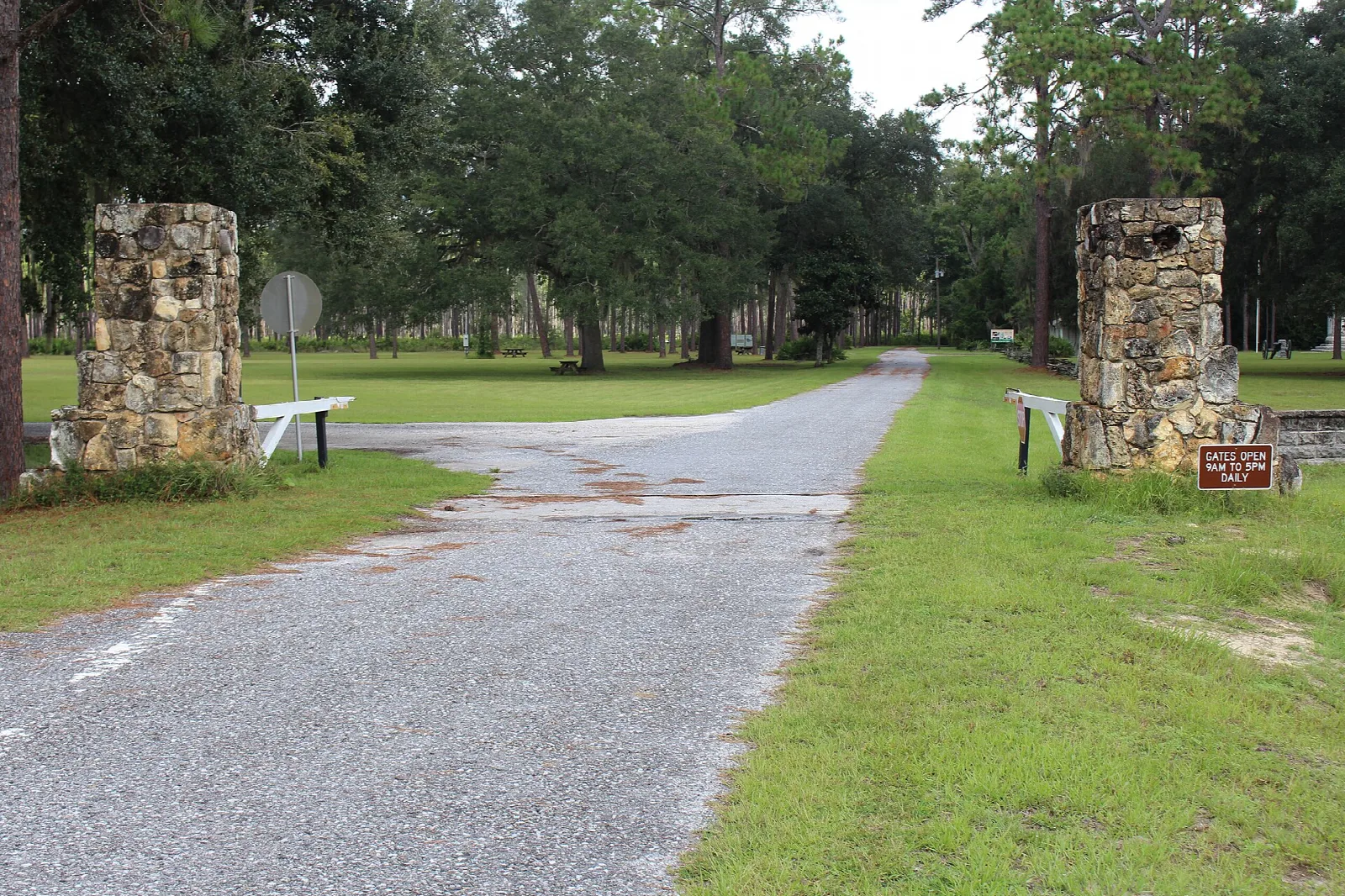 Park road passing between two stone gate posts