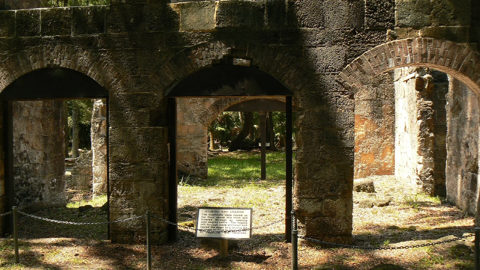 Arched stone doorways and walls of old plantation ruins