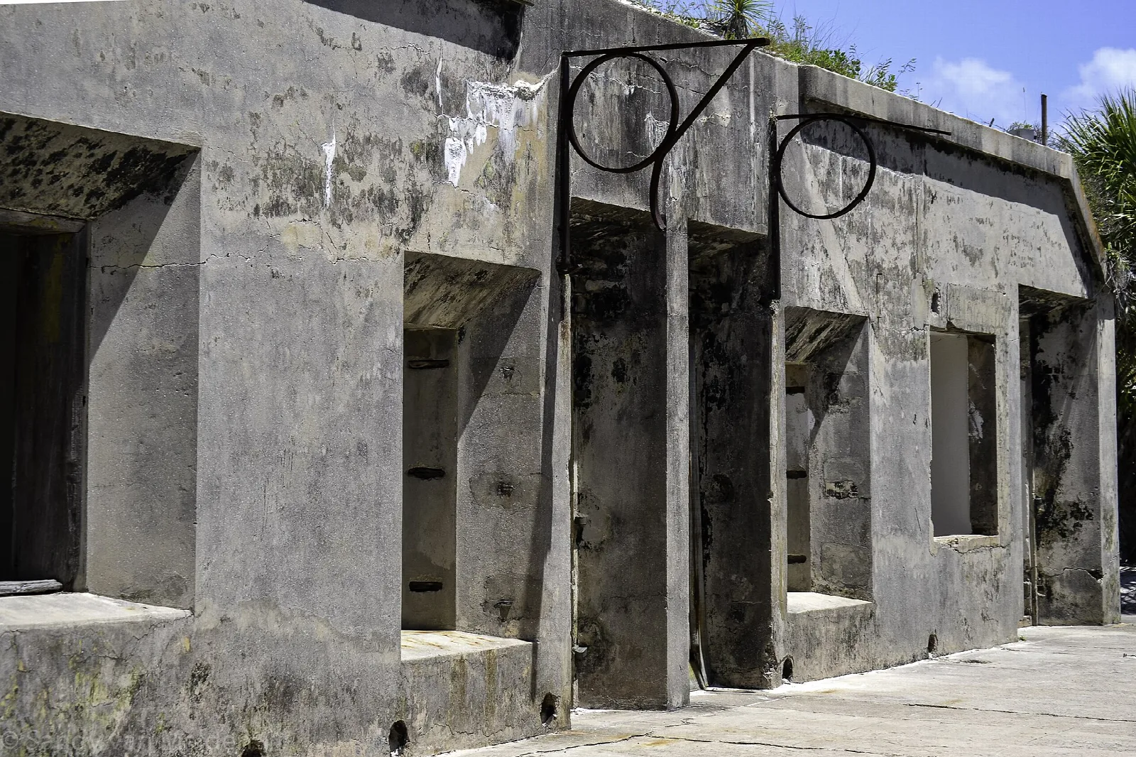 Weathered concrete fort building with window openings