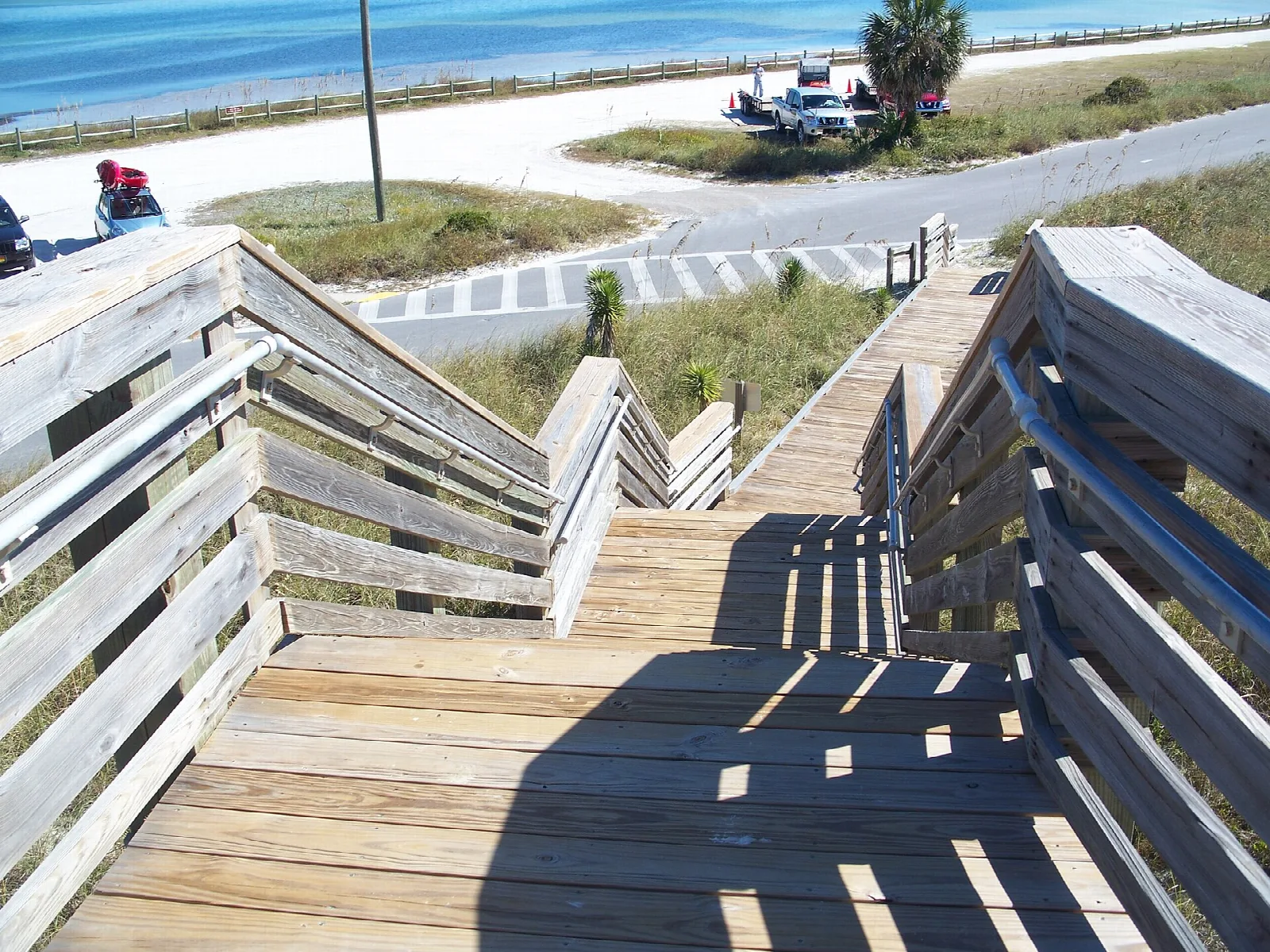 Wood stairs and boardwalk down toward the beach