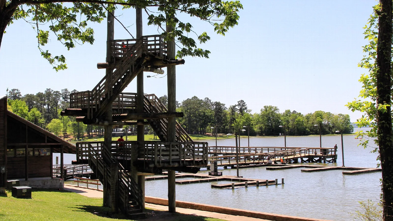 Wooden observation tower beside the marina and lake