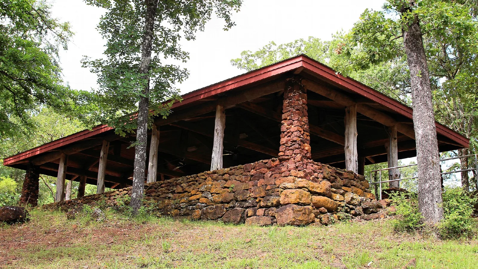 Stone and timber group pavilion among oak trees