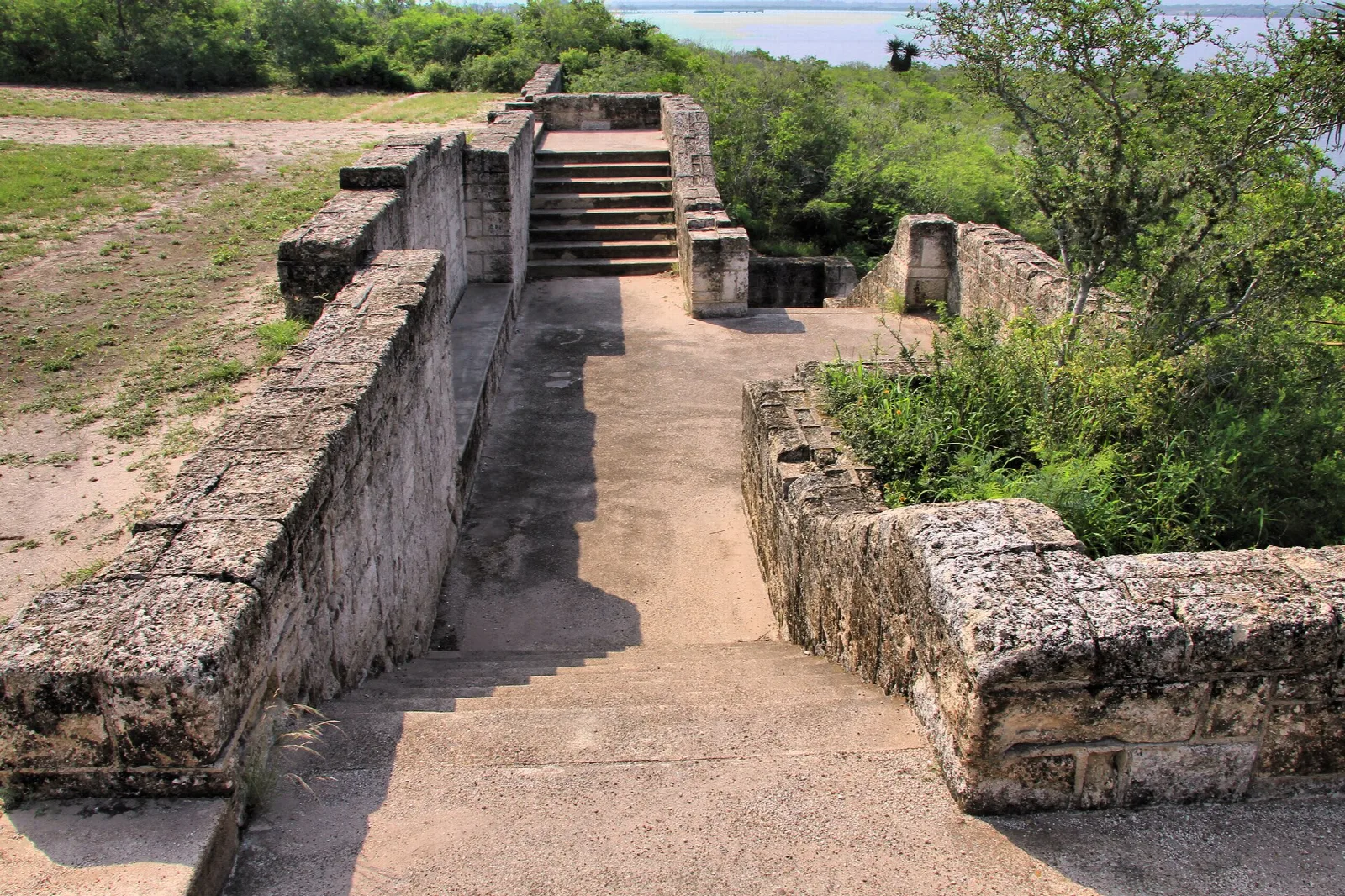 Stone staircase and walls leading down a slope
