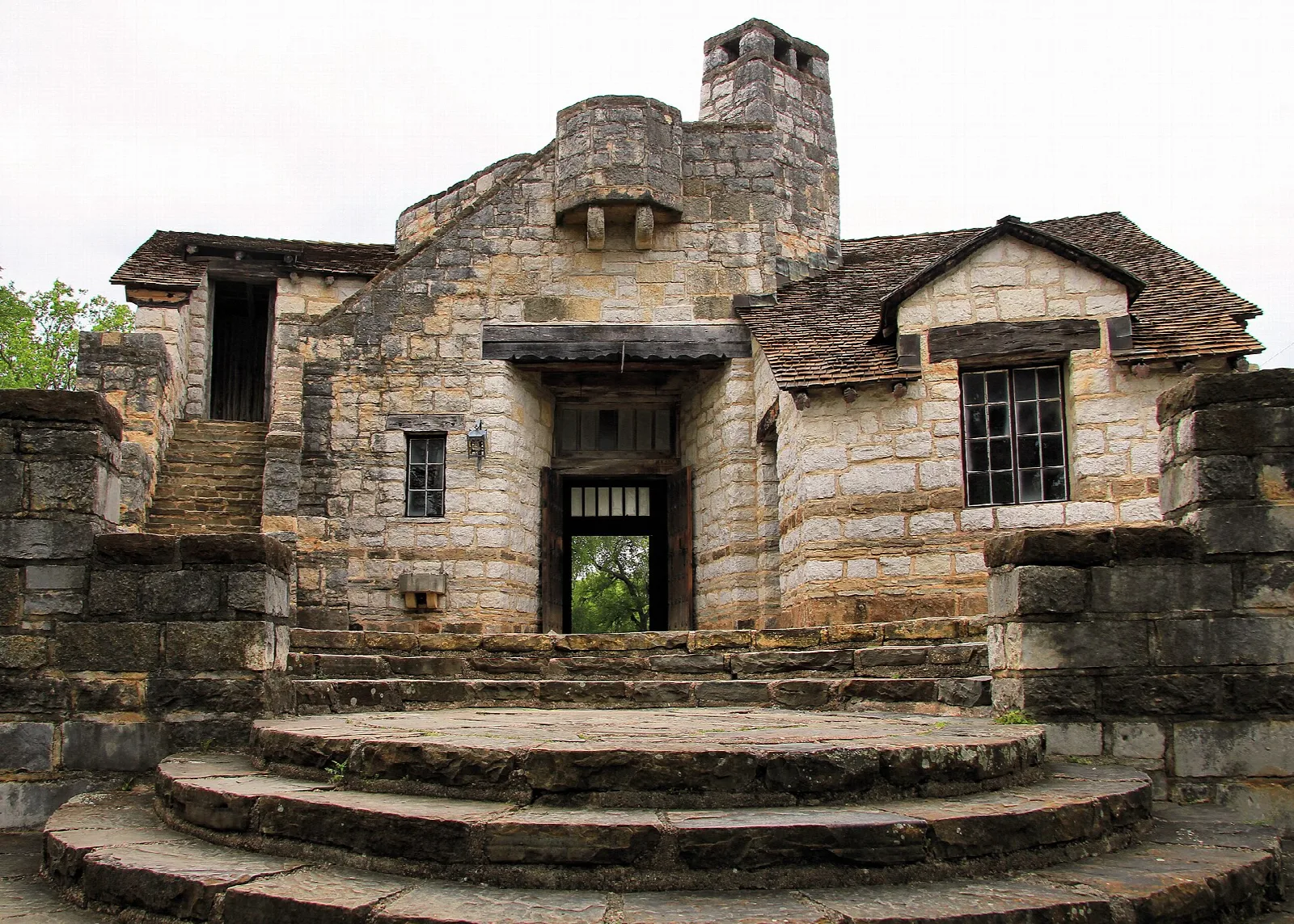Stone administration building with steps, built of local rock