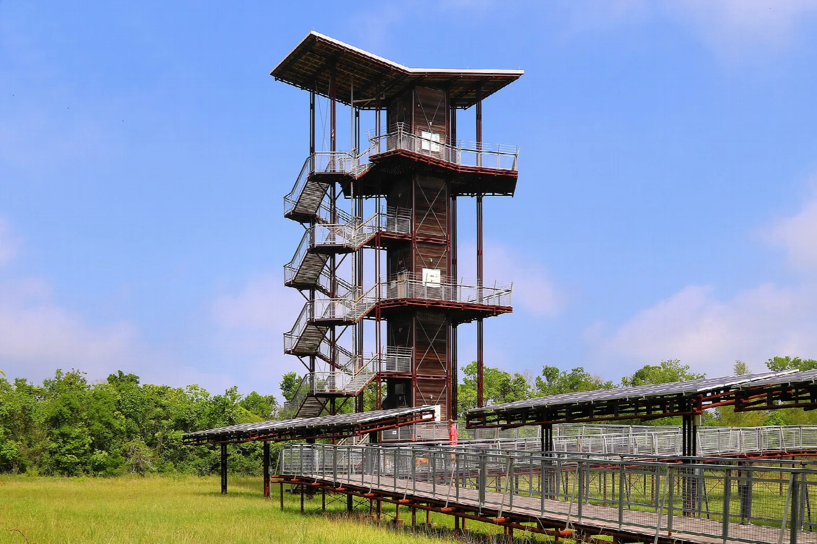 Tall metal observation tower beside a boardwalk