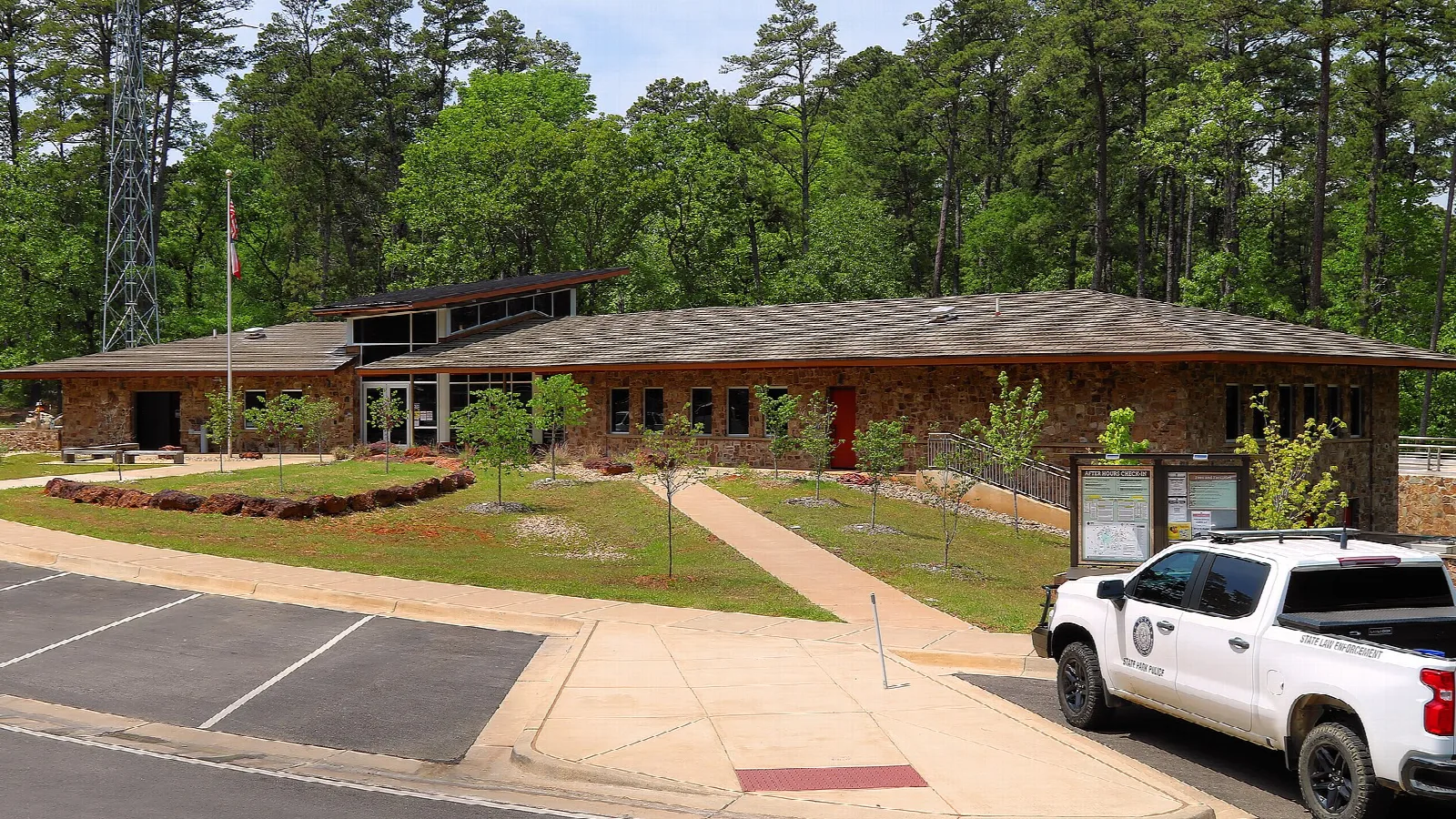 Park headquarters building among tall pines