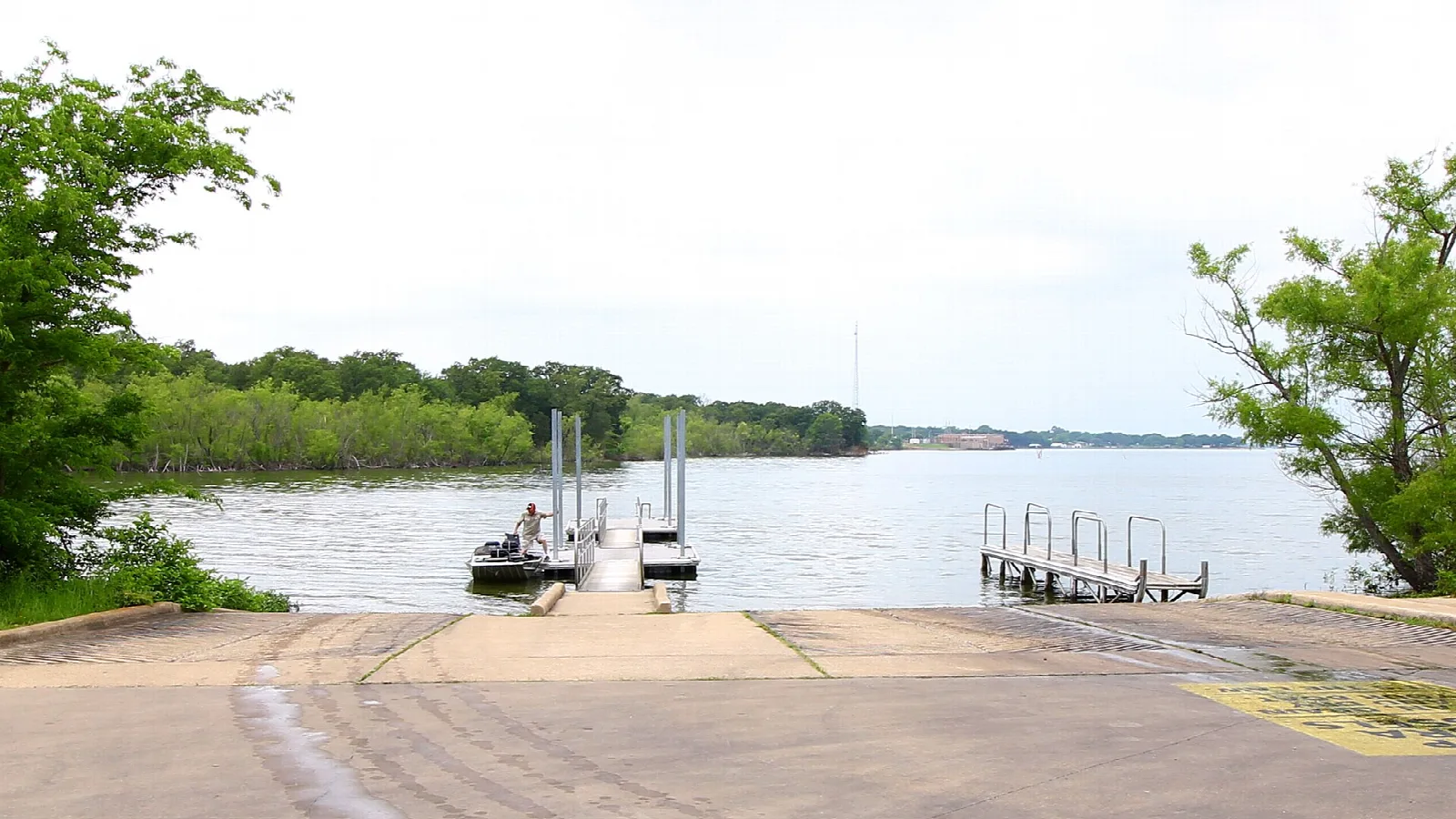 Boat ramp and dock on a wide lake