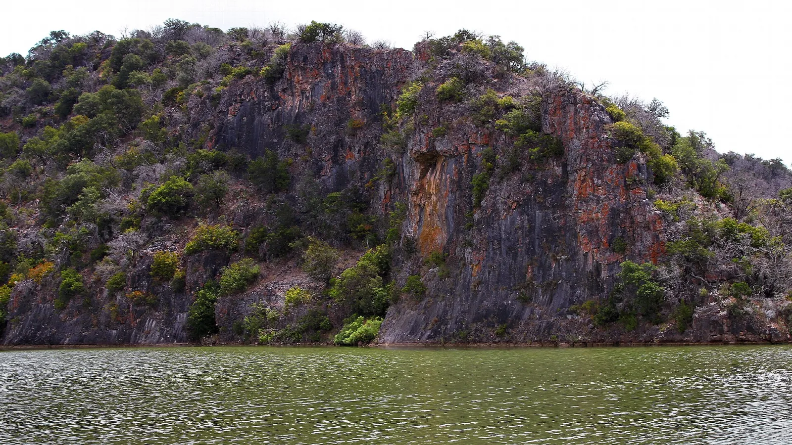 Rocky cliffs rising above a river