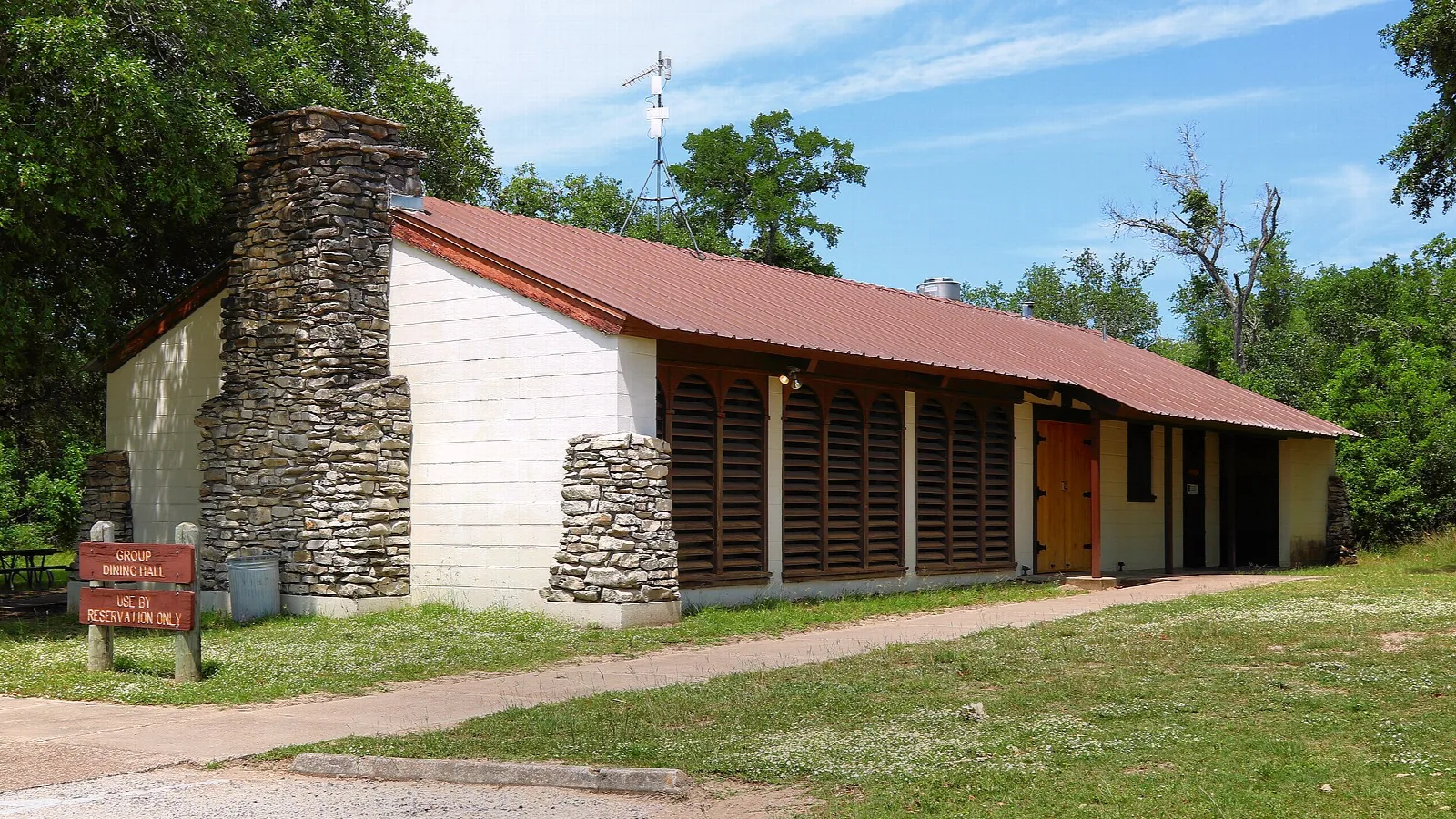 Stone and wood hall with a red roof
