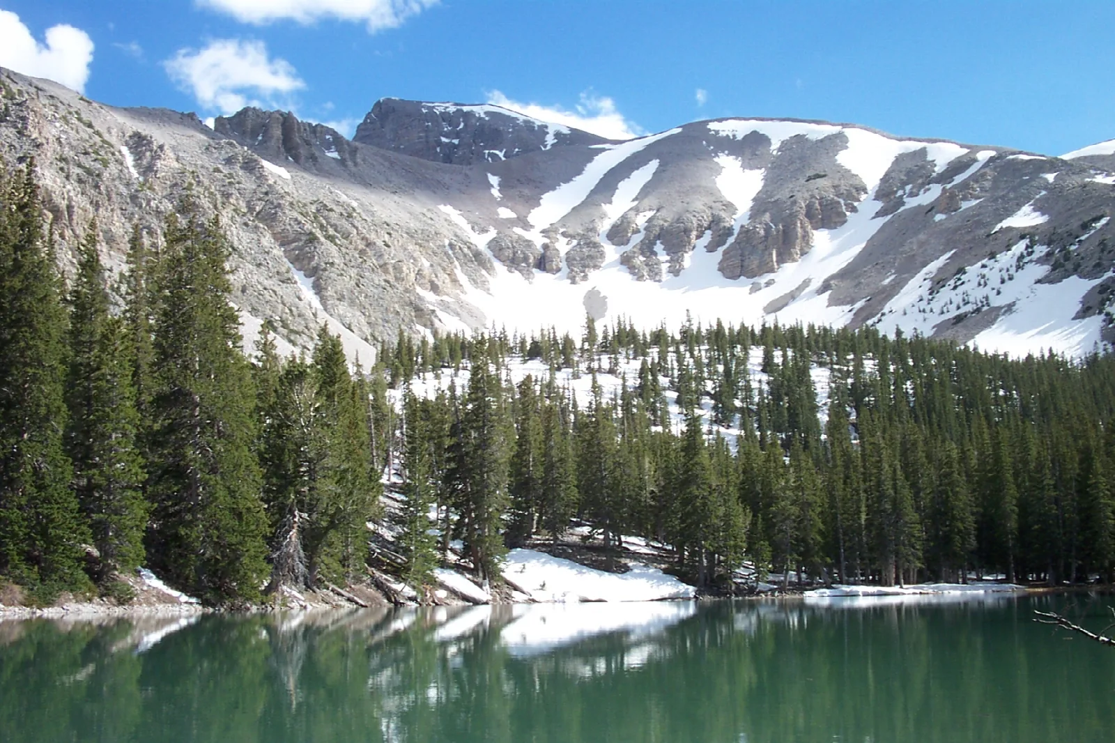 Alpine lake with mountain in the background